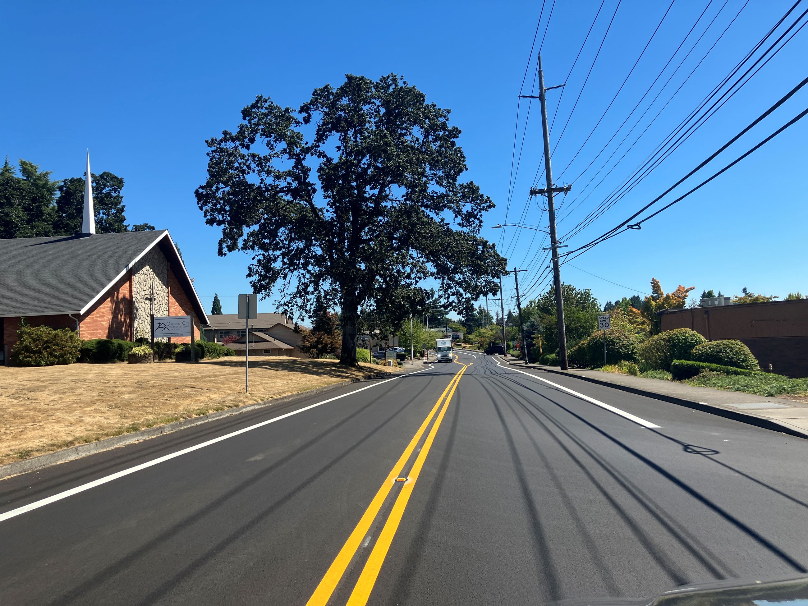 Picture of Warner Milne roadway with new paving and new striping depicting a smooth roadway
