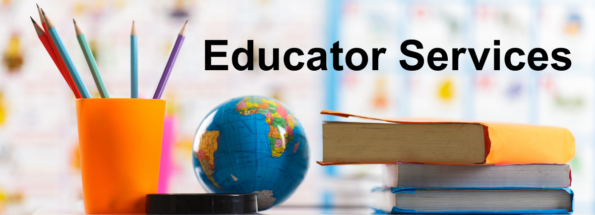 picture of books, small globe, pencel holder on school desk