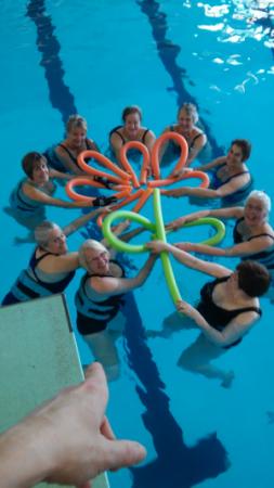 People in Pool with Pool Toys